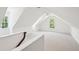 Finished attic space with white walls, ceiling fan, carpet, and large windows at 380 Tidal Reef Cir, Mount Pleasant, SC 29464