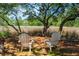 Backyard featuring two white chairs beneath a shade tree with a view of the water at 380 Tidal Reef Cir, Mount Pleasant, SC 29464