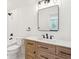 Bathroom with white walls, wood vanity, and a large mirror at 380 Tidal Reef Cir, Mount Pleasant, SC 29464