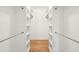 Walk-in closet featuring built-in shelving and chrome rods on each side at 380 Tidal Reef Cir, Mount Pleasant, SC 29464