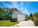 Charming home with a two car garage surrounded by lush greenery and a blue sky at 380 Tidal Reef Cir, Mount Pleasant, SC 29464