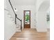 Welcoming foyer with wood floors, staircase, and natural light, creating an open and inviting space at 380 Tidal Reef Cir, Mount Pleasant, SC 29464