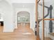 Inviting foyer with hardwood floors, white trim, and an arched entryway leads to the living area at 380 Tidal Reef Cir, Mount Pleasant, SC 29464