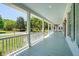 Spacious front porch with a light blue ceiling, perfect for relaxing and enjoying the outdoors with serene views at 380 Tidal Reef Cir, Mount Pleasant, SC 29464