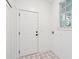 Bright mudroom featuring patterned tile flooring and a paneled entry door at 380 Tidal Reef Cir, Mount Pleasant, SC 29464