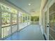 Screened-in porch with ceiling fan offers a relaxing outdoor living space and backyard view at 380 Tidal Reef Cir, Mount Pleasant, SC 29464