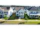 Aerial view of a charming home with double porches in a neatly arranged neighborhood with green lawns at 403 Cool Bend Ln, Summerville, SC 29486