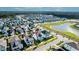 A new construction home in an aerial view, showcasing the desirable community and serene pond at 403 Cool Bend Ln, Summerville, SC 29486