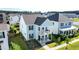 Aerial view of a beautiful two-story home featuring double porches and well-kept landscaping within a residential community at 403 Cool Bend Ln, Summerville, SC 29486