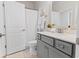Well-lit bathroom featuring a modern gray vanity, a large mirror, and stylish fixtures at 403 Cool Bend Ln, Summerville, SC 29486