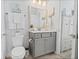 Charming bathroom with gray vanity, neutral tile floor, and decorative accents for a relaxing atmosphere at 403 Cool Bend Ln, Summerville, SC 29486