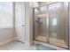 Modern bathroom featuring a glass-enclosed shower with gray tiling and sleek fixtures at 403 Cool Bend Ln, Summerville, SC 29486