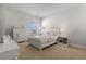 Bright bedroom with a floral-themed bedspread, dresser, and desk, creating a charming space at 403 Cool Bend Ln, Summerville, SC 29486