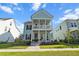 Beautiful two-story home with double porches, set against a bright blue sky and lush green lawn at 403 Cool Bend Ln, Summerville, SC 29486