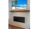 Living room modern fireplace with shiplap and a wooden mantle at 403 Cool Bend Ln, Summerville, SC 29486