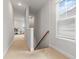 Upstairs hallway in neutral tones with lots of natural light at 403 Cool Bend Ln, Summerville, SC 29486