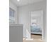 Bright hallway with an entrance into a bedroom, carpeted floors, and a window at 403 Cool Bend Ln, Summerville, SC 29486