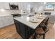 Kitchen island with seating, quartz countertops, and stainless steel appliances for modern living at 403 Cool Bend Ln, Summerville, SC 29486