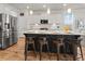 Kitchen with island seating, stainless appliances, white cabinetry, and granite countertops at 403 Cool Bend Ln, Summerville, SC 29486