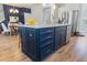 Kitchen island with breakfast bar seating complements stainless appliances and a dining area at 403 Cool Bend Ln, Summerville, SC 29486