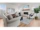 Bright living room with a fireplace and a large plant to complete the space at 403 Cool Bend Ln, Summerville, SC 29486