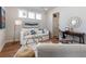 Cozy living room with a plush white sofa, stylish gold accents, and bright natural lighting at 403 Cool Bend Ln, Summerville, SC 29486