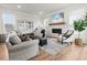 Cozy living room with fireplace, shiplap accent wall, and modern decor at 403 Cool Bend Ln, Summerville, SC 29486