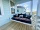 Charming porch with a swing sofa, providing a comfortable spot to enjoy the outdoors at 403 Cool Bend Ln, Summerville, SC 29486