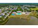 Aerial view of the neighborhood amenities including a pool, lake, and clubhouse at 422 Verbena Ave, Summerville, SC 29483