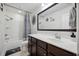 This bathroom features a shower/tub combo and a vanity sink with a large mirror at 422 Verbena Ave, Summerville, SC 29483