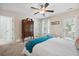 Charming bedroom features a ceiling fan, an antique armoire, and access to the backyard at 422 Verbena Ave, Summerville, SC 29483