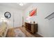 Stylish entryway featuring wood-look flooring, a mid-century modern cabinet, and a round mirror at 422 Verbena Ave, Summerville, SC 29483
