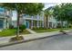 Charming two-story home with a welcoming front porch, lush green lawn, and mature trees lining the street at 422 Verbena Ave, Summerville, SC 29483
