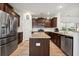 Well-equipped kitchen with stainless steel appliances, dark wood cabinetry, and a center island at 422 Verbena Ave, Summerville, SC 29483