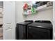 This laundry room features a washer, dryer, and shelving for storage at 422 Verbena Ave, Summerville, SC 29483