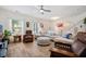 Bright and airy living room with neutral sectional, ceiling fan, and lots of natural light at 422 Verbena Ave, Summerville, SC 29483