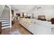 Bright living room with wood floors, a comfortable sofa, and open layout connecting to the kitchen at 422 Verbena Ave, Summerville, SC 29483