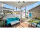 Inviting screened porch features comfortable seating, ceiling fan, and views of the outdoor area at 422 Verbena Ave, Summerville, SC 29483