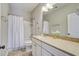 Well-lit bathroom with granite countertops, modern fixtures, and a shower-tub combo at 4303 Misty Hollow Ln, Ravenel, SC 29470