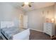 Comfortable bedroom featuring carpet floors, a bed, dresser, and ceiling fan at 4303 Misty Hollow Ln, Ravenel, SC 29470