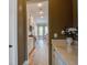 Hallway with butler's pantry area leading to a kitchen and dining area at 4303 Misty Hollow Ln, Ravenel, SC 29470