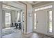 Bright foyer with wood flooring, a study view, and a front door with sidelights at 4303 Misty Hollow Ln, Ravenel, SC 29470