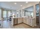 Modern kitchen with an island, stainless steel appliances, and views of the dining and living areas at 4303 Misty Hollow Ln, Ravenel, SC 29470