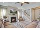 Spacious living room with a fireplace, ceiling fan, and hardwood floors at 4303 Misty Hollow Ln, Ravenel, SC 29470
