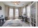 Bright home office featuring hardwood floors, large windows and a ceiling fan at 4303 Misty Hollow Ln, Ravenel, SC 29470