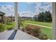 Inviting porch view showcasing beautiful landscaping and neighborhood scenery at 4303 Misty Hollow Ln, Ravenel, SC 29470