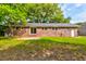 Exterior of brick home with sliding glass door to patio at 4327 Bream Rd, North Charleston, SC 29418