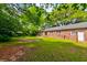 Brick home with a patio in large yard at 4327 Bream Rd, North Charleston, SC 29418