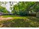 Well-maintained backyard with lush greenery and storage sheds at 4327 Bream Rd, North Charleston, SC 29418