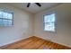 Bedroom with hardwood floors and dual windows providing natural light at 4327 Bream Rd, North Charleston, SC 29418